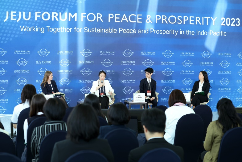 A group of people sitting at a tableDescription automatically generated