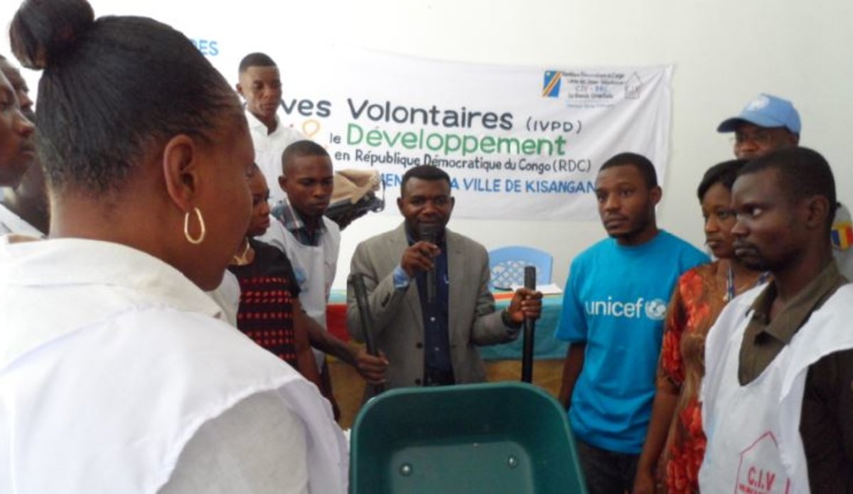 United Nations Volunteers provide a batch of sanitation tools to Congolese Youth Volunteers Corps