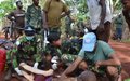  Indonesian peacekeepers assist victims of a serious road accident 